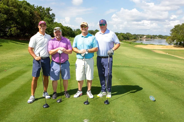 A group of players on the fairway
